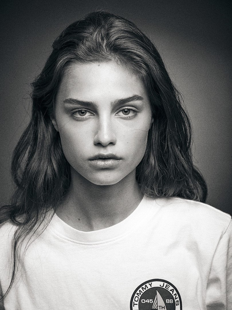 Headshot of Anna Rossolovich with a Tommy Hilfiger T-shirt in my studio
