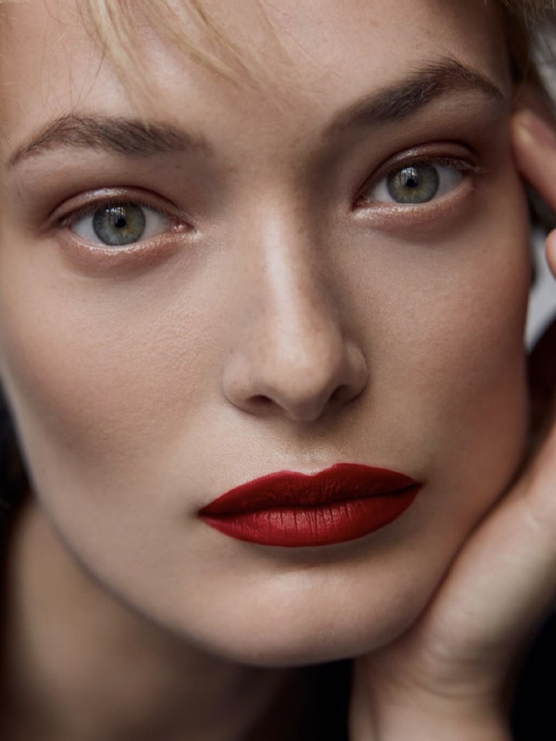 Perfect expression in this very close headshot with red lips and
