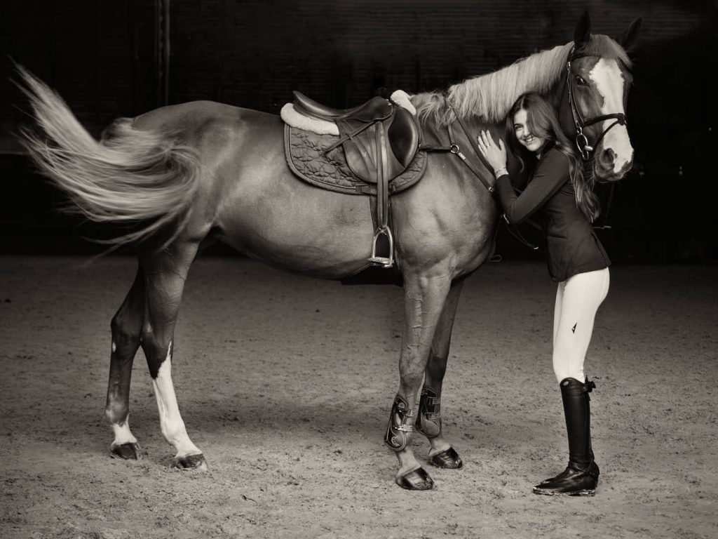 Celebrity en Barcelona Sira Martínez poses with her horse in an intimate portrait captured by celebrity photographer Julio Bárcena. Retrato de los jinetes de élite Sira Martínez y Alex Codina en Barcelona, Real Club de Polo para La VAnguardia Magazine